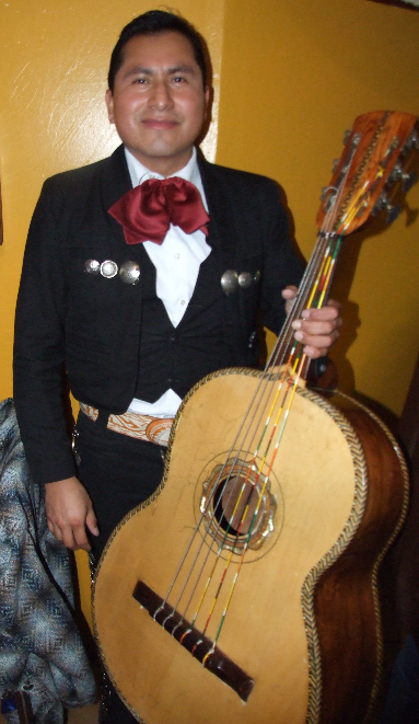 Mexican guitarron player poses for photograph