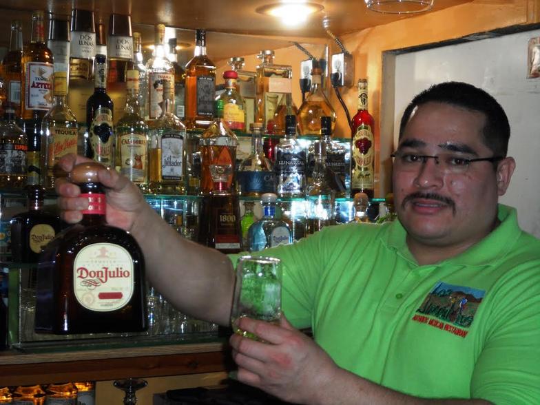 Bartender with bottle of Don Julio Tequila