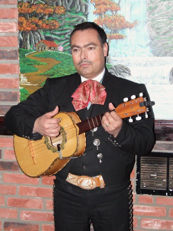 Mexican guitar player performs Live at Los Jimadores Restaurant