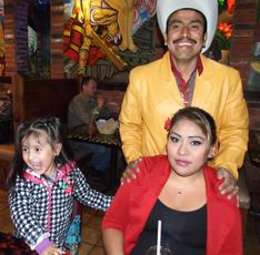 Dad with mom and child at Mexican restaurant